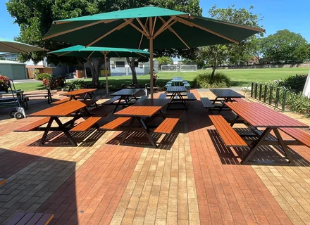 Assembled outdoor picnic table setting on a deck