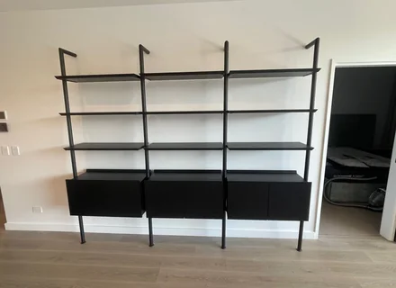 Assembled black modular shelving and sideboard