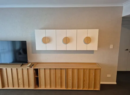 Assembled timber TV wall unit and floating shelves