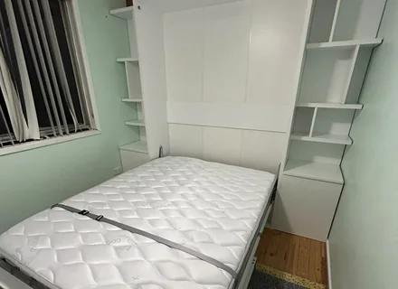 Wall bed assembled and folded down with mattress