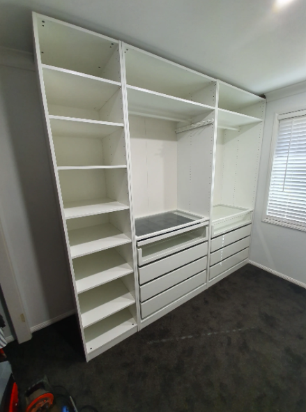 Assembled wardrobe with shelves